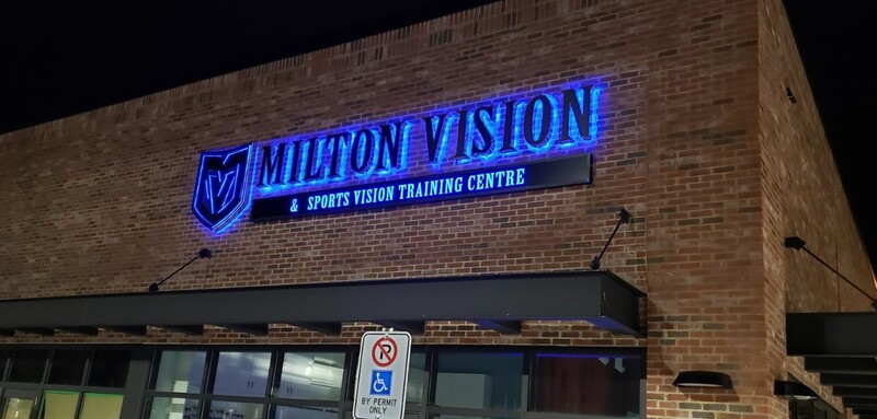 Exterior backlit LED sign photographed at night showing illumination quality