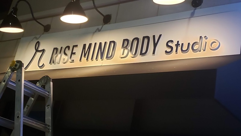 Indoor overhead sign for a Cambridge mind and body studio